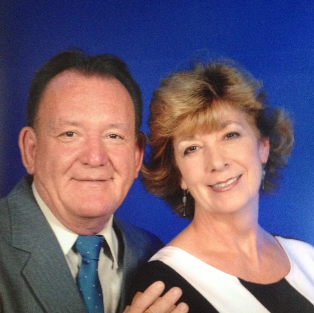 A man and woman standing next to each other.